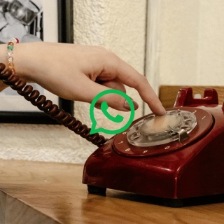 Business user setting up WhatsApp with a landline number on a smartphone