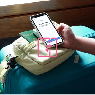 Person transferring an eSIM to a new phone by scanning a QR code during setup