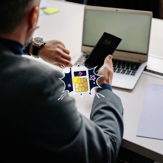 Small business owner using a smartphone with an eSIM to manage business and personal lines