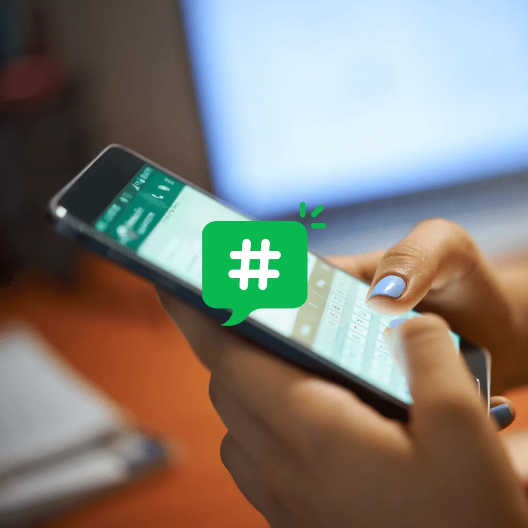 Smartphone showing WhatsApp chats linked to a dedicated business phone number